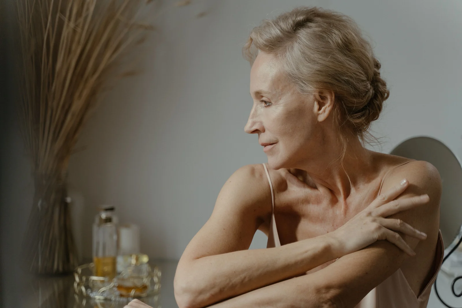 A woman at her dressing table in the morning