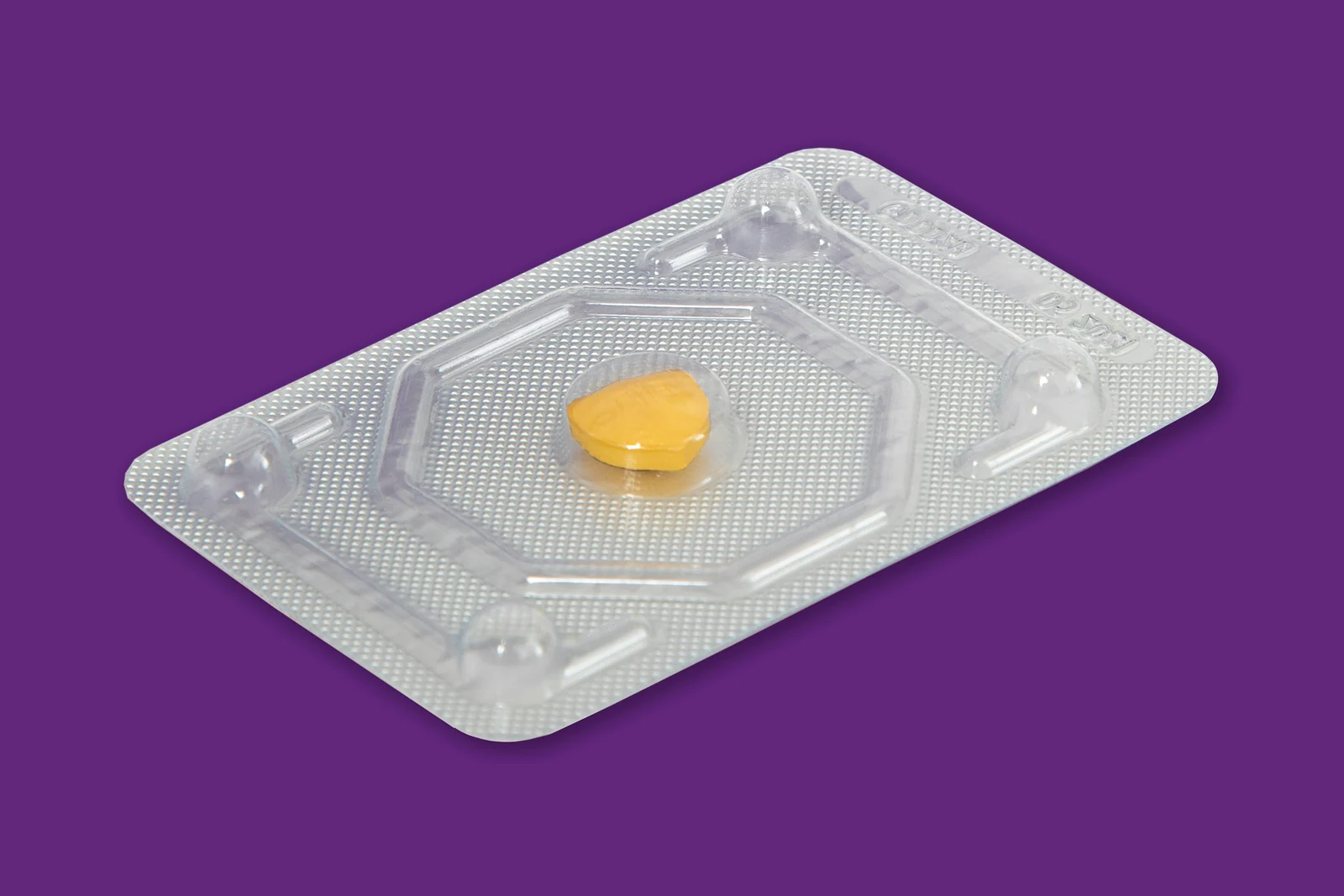 A single tablet in its blister packaging