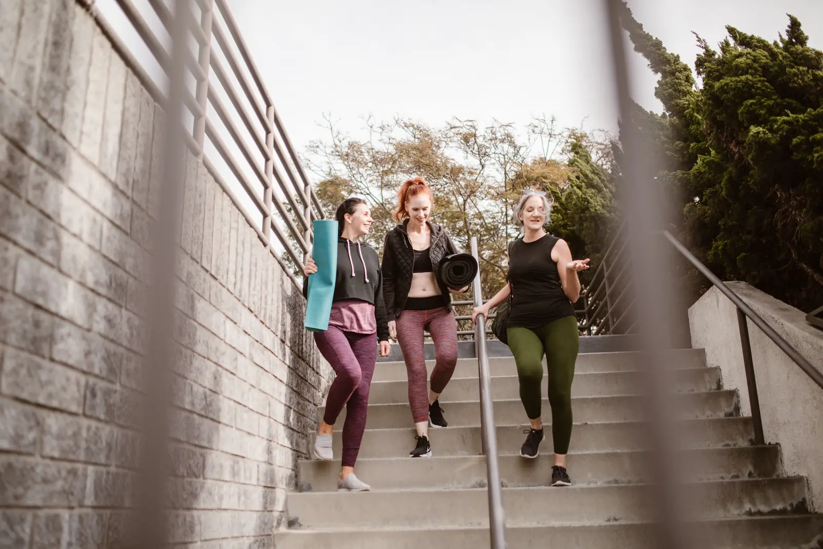 Women walking down steps after an exercise class